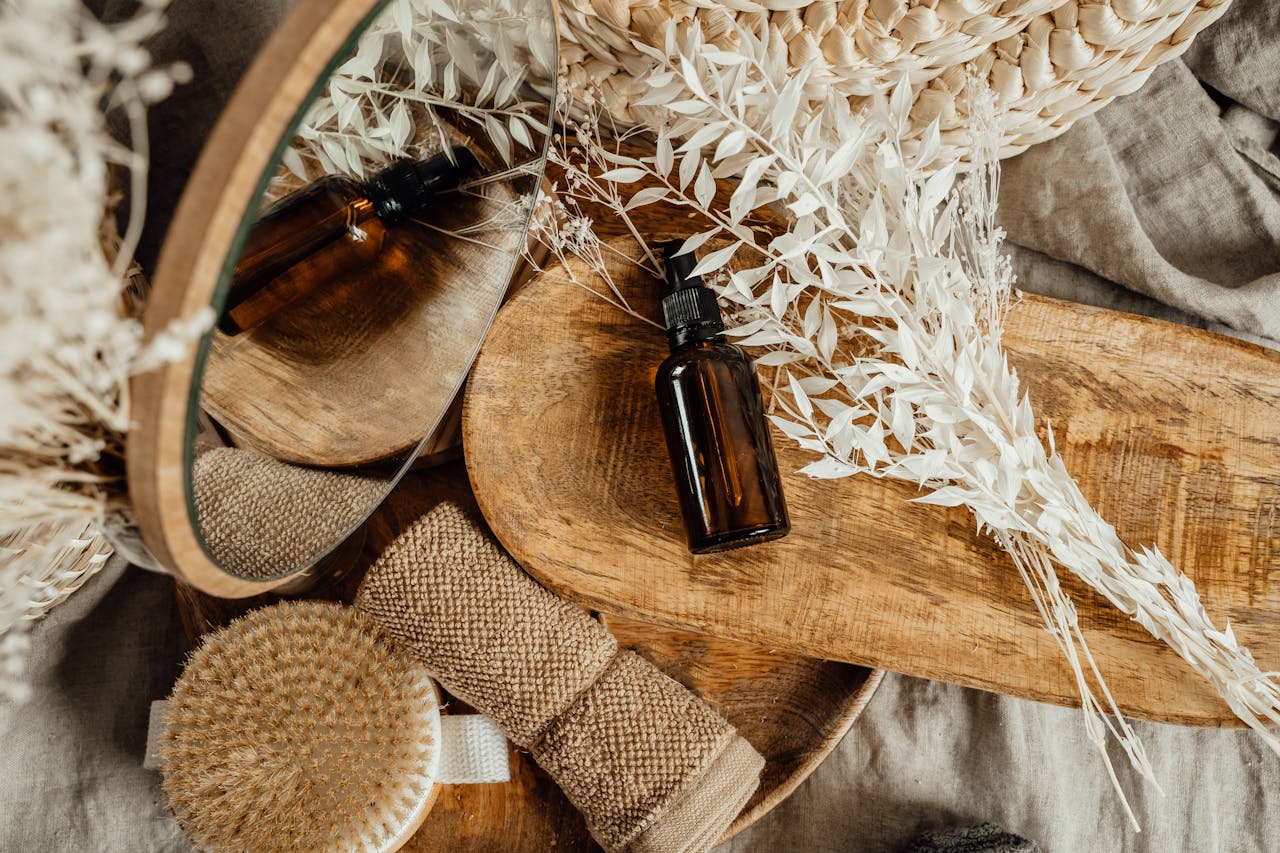 Top View of Composition of Bathroom Supplies Lying on a Wooden Tray